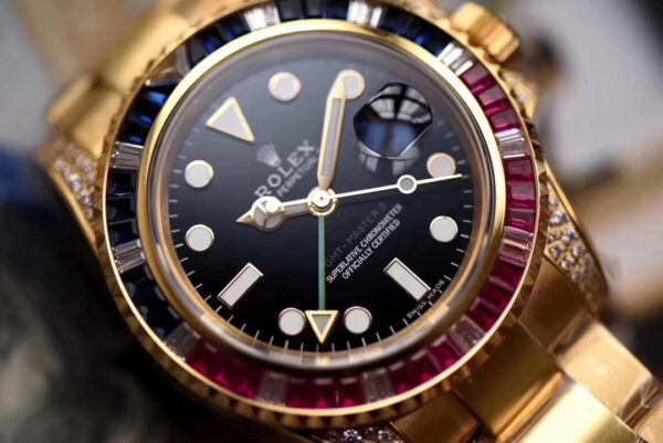 Rolex GMT-Master II, Oyster, 40 mm, Oyestersteel and yellow gold, red and blue diamond bezel