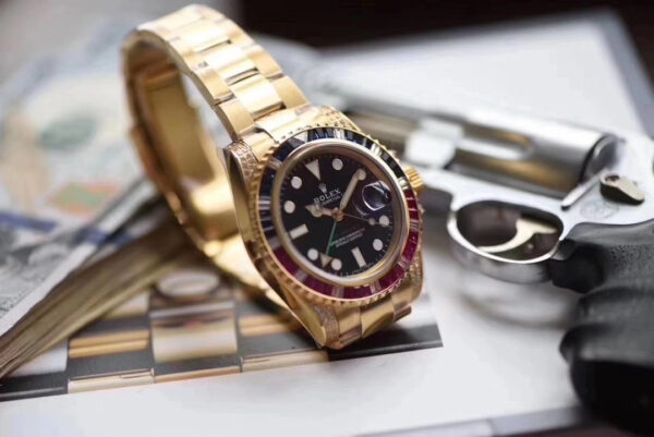 Rolex GMT-Master II, Oyster, 40 mm, Oyestersteel and yellow gold, red and blue diamond bezel