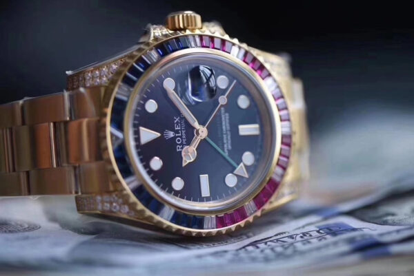 Rolex GMT-Master II, Oyster, 40 mm, Oyestersteel and yellow gold, red and blue diamond bezel