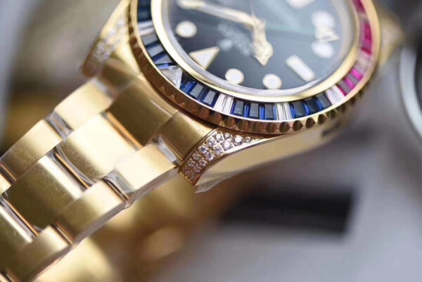 Rolex GMT-Master II, Oyster, 40 mm, Oyestersteel and yellow gold, red and blue diamond bezel