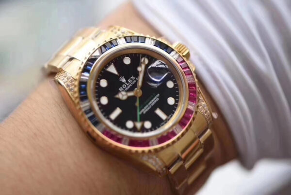 Rolex GMT-Master II, Oyster, 40 mm, Oyestersteel and yellow gold, red and blue diamond bezel